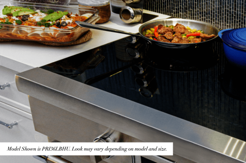 Frameless black glass cooktop covers the surface - PRI36LBHC