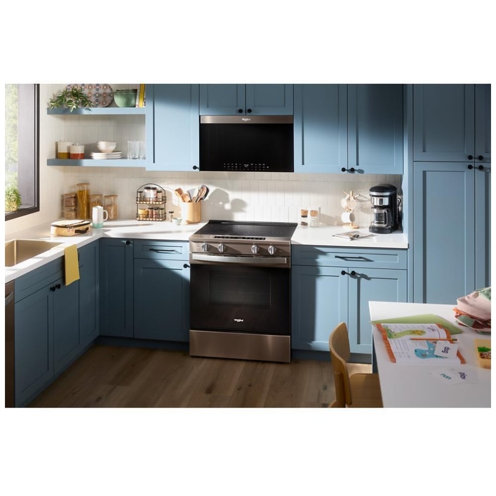 Whirlpool slide-in electric range installed in a modern kitchen